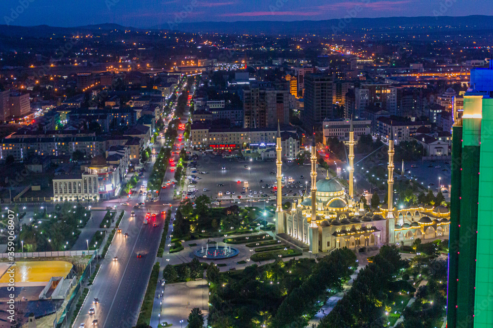Fototapeta premium Night aerial view of Akhmad Kadyrov Mosque (officially known as The Heart of Chechnya) in Grozny, Russia