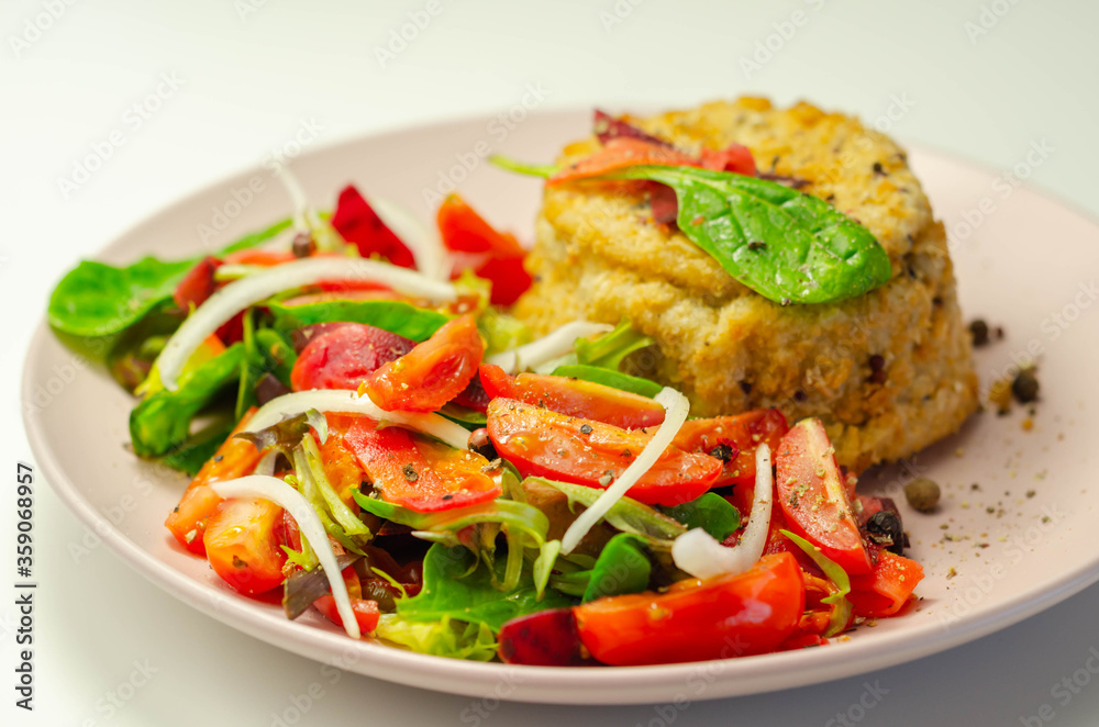 Smoked haddock fishcake with melting cheddar sauce and mixed salad Smoked haddock fishcake with melting cheddar sauce and mixed salad