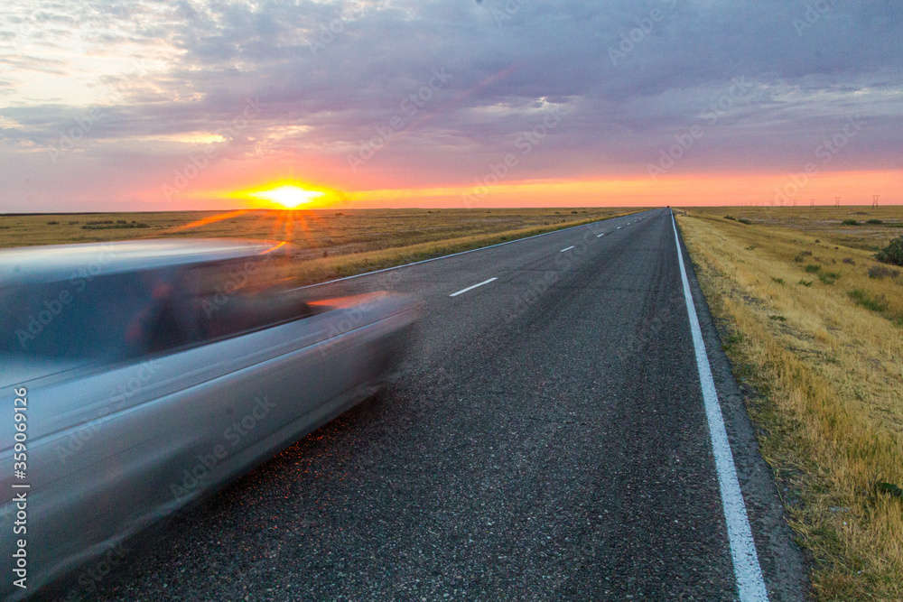 Sunset view of a road in russian steppe