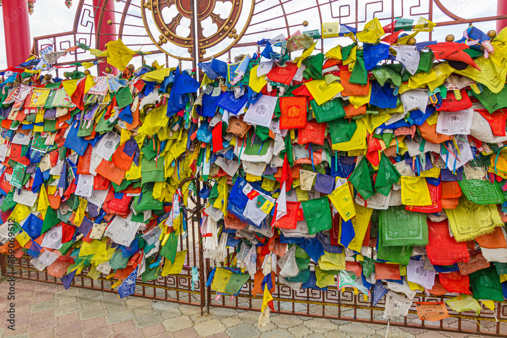 Buddhist flags at the gate of the Buddhist temple complex The Golden Abode of the Buddha Shakyamuni in Elista, Russia
