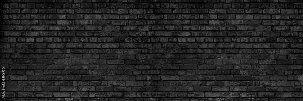 Background Of Old Vintage Dirty Dark Black Brick Wall With Peeling Plaster. Shabby Building Facade. Long Panoramic Banner.