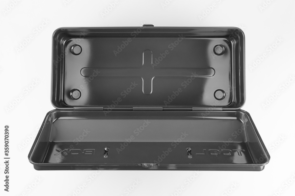 Traditional black steel toolbox with a hinged lid shot open and top down in a seamless white studio. Traditional black steel toolbox with a hinged lid shot open and top down in a seamless white studio.