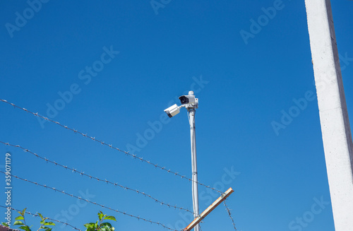 camera at the top of the electric pole