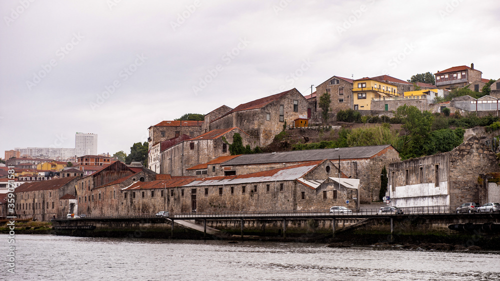 It's Houses on the bank of the River Douro in Porto, Portugal. View from the River Douro, one of the major rivers of the Iberian Peninsula (2157 m)