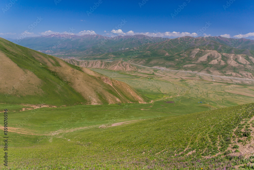 Grass covered hills near Song Kul lake, Kyrgyzstan