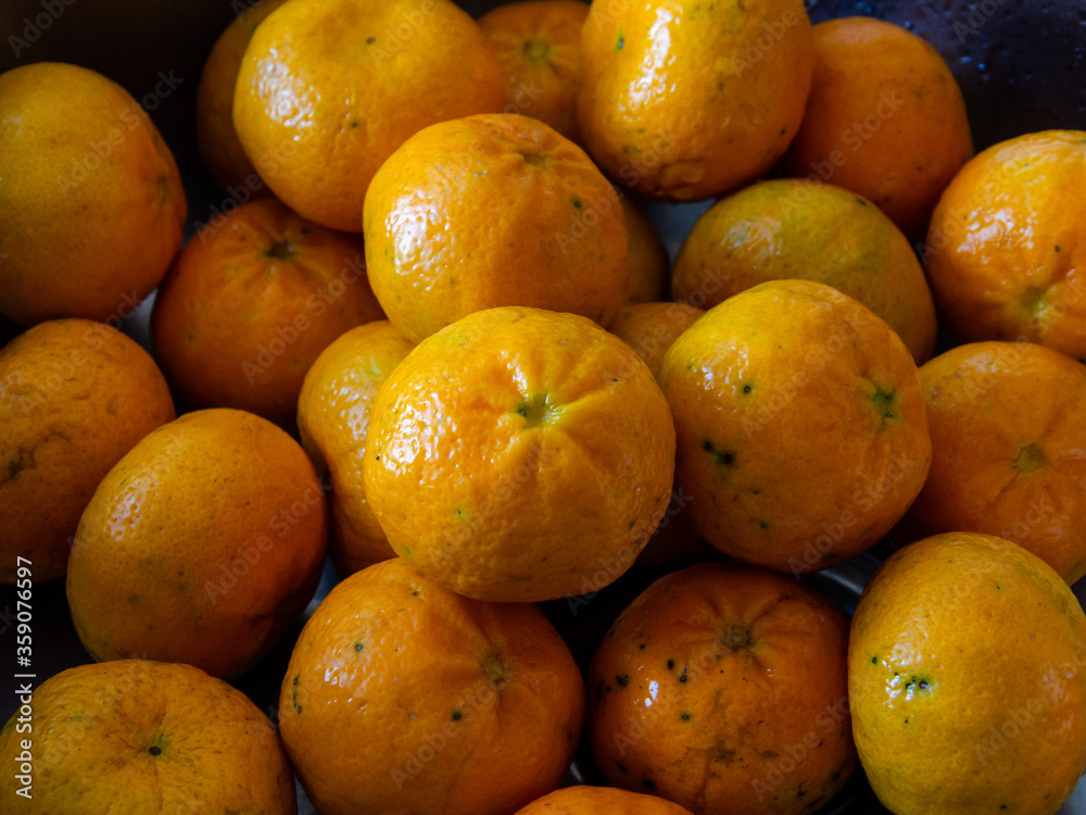 close up on pile of tangerines close up on pile of tangerines