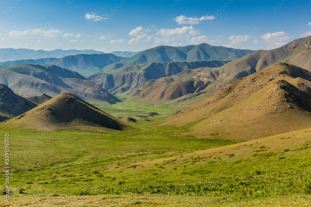 Green meadows in mountains near Song Kul lake, Kyrgyzstan