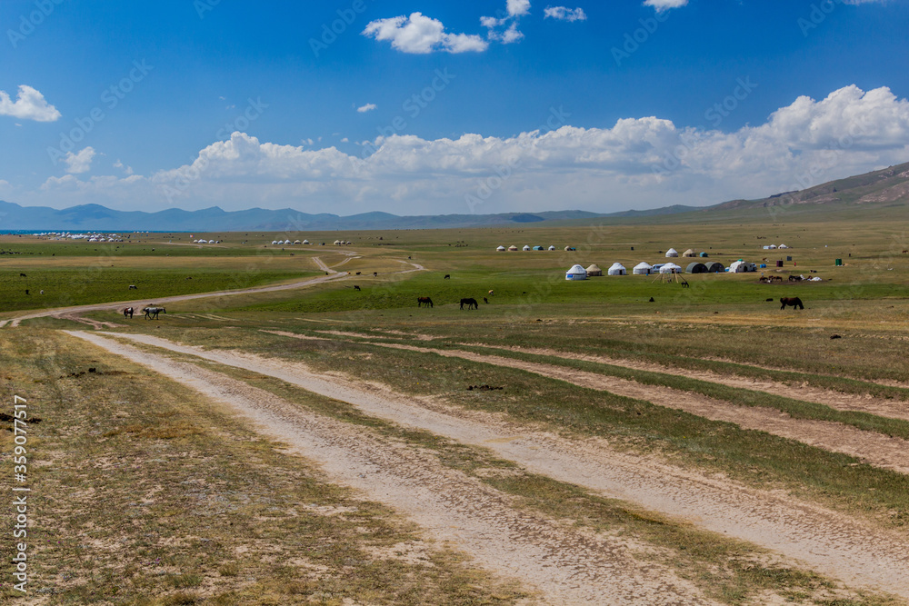 Obraz premium Yurt camps at the shores of Song Kul lake, Kyrgyzstan