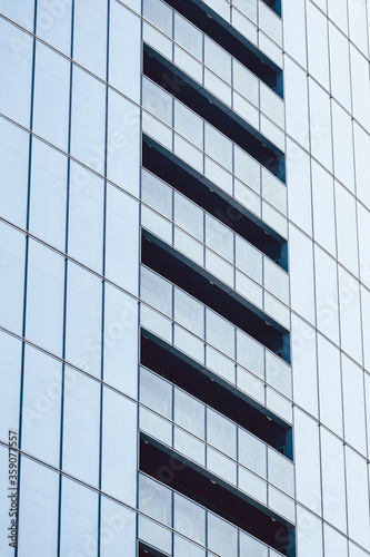 Facade of a glass building with open walkways