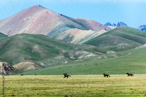 Kyrgyz horse riders at the shores of Song Kul Lake, Kyrgyzstan © Matyas Rehak
