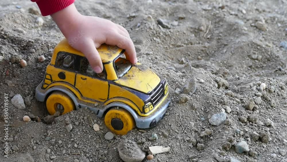 babies playing with soil, a child is playing with soil, babies playing with soil, a child is playing with soil,