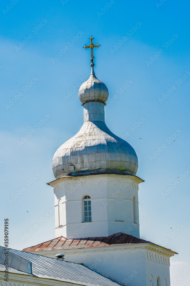 It's St. George's (Yuriev) Monastery, Russia's oldest monastery. It is part of the World Heritage Site named Historic Monuments of Novgorod and Surroundings.