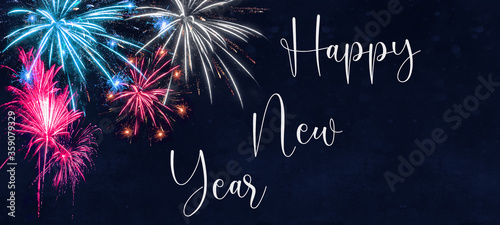 HAPPY NEW YEAR - Silvester background - Colorful firework on dark blue black night texture