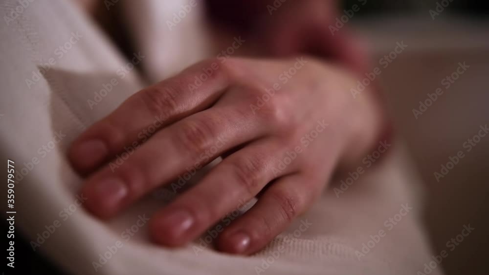 The masseur massages the girls hands under romantic light The masseur massages the girls hands under romantic light