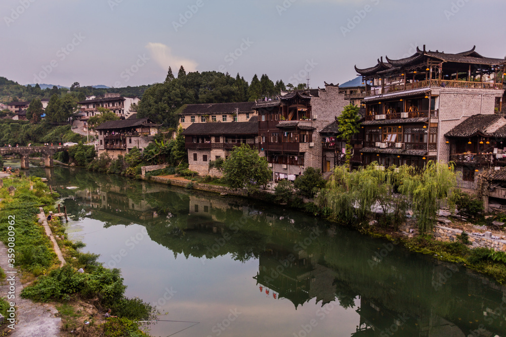Houses reflecting in a river in Furong Zhen town, Hunan province, China