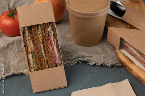 Soup and sandwiches in eco packaging - with fresh vegetables, tuna, lean vegetable ham. Vegan food.