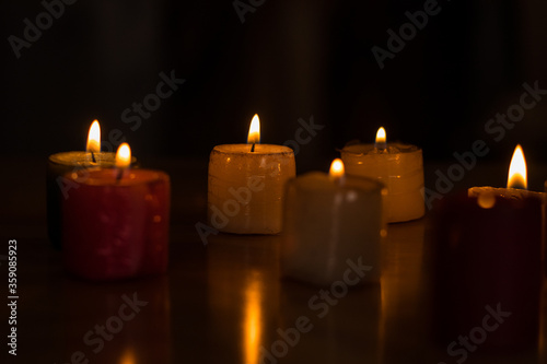colorful candles lit at twilight 