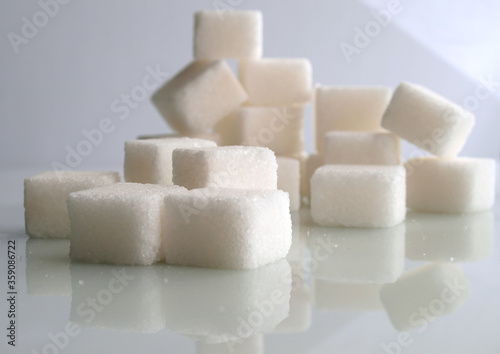 sugar cubes over white background