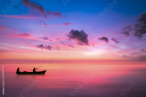 small boat and Fisherman Before sunrise in the sea with negative space 