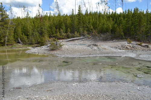 Obraz na plátne Late Spring in Yellowstone National Park: Dishwater Spring Atop a Geyserite Moun