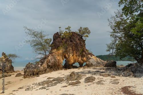 Scenic view at Ao khao kwai beach on Phayam island. Called Hin Ta Lu  (Through rock) photo