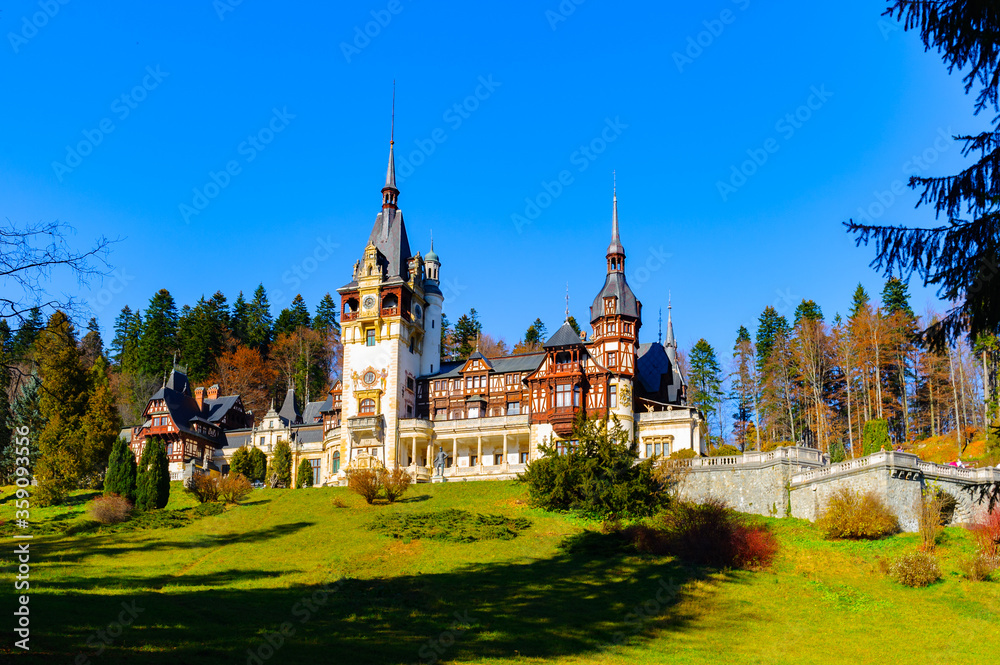 It's Panorama of the Peles Castle, a Neo-Renaissance castle in the Carpathian Mountains of Romania It's Panorama of the Peles Castle, a Neo-Renaissance castle in the Carpathian Mountains of Romania