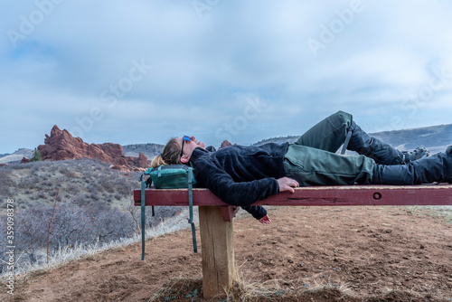 Hiker on bench at Roxborough state park photo