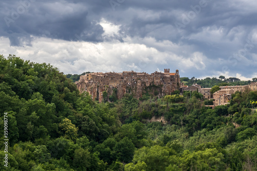 Calcata, small medieval village, Italy. Panoramic view of the village of Calcata, in the province of Viterbo, Italy. Medieval village built entirely of tuff and immersed in the green of the forest.