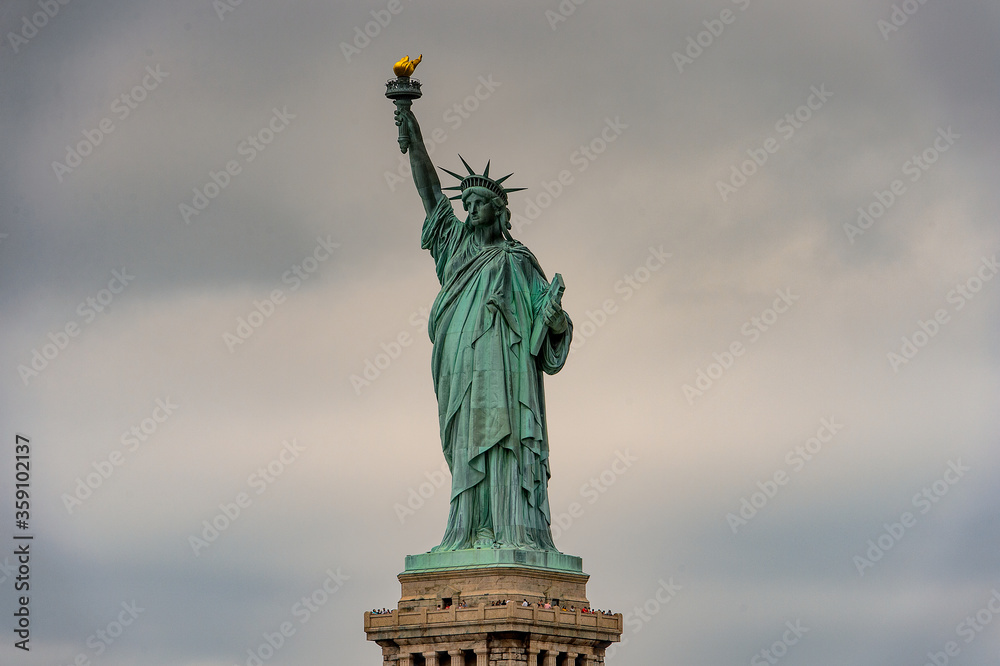 Fototapeta premium Statue of Liberty of New York on a cloudy day, NY, United Sates of America