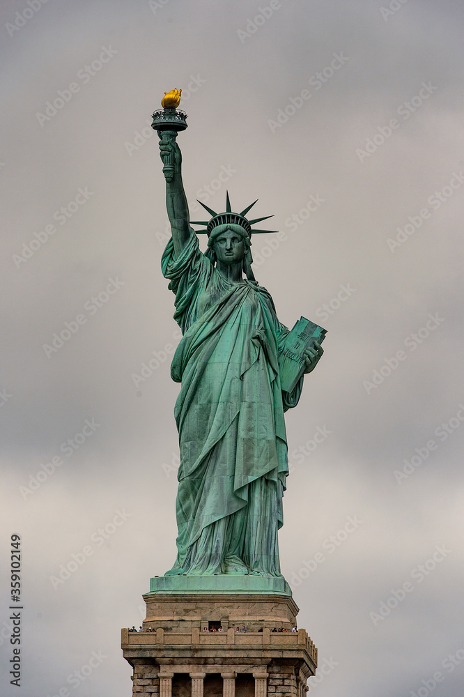 Obraz premium Statue of Liberty of New York on a cloudy day, NY, United Sates of America