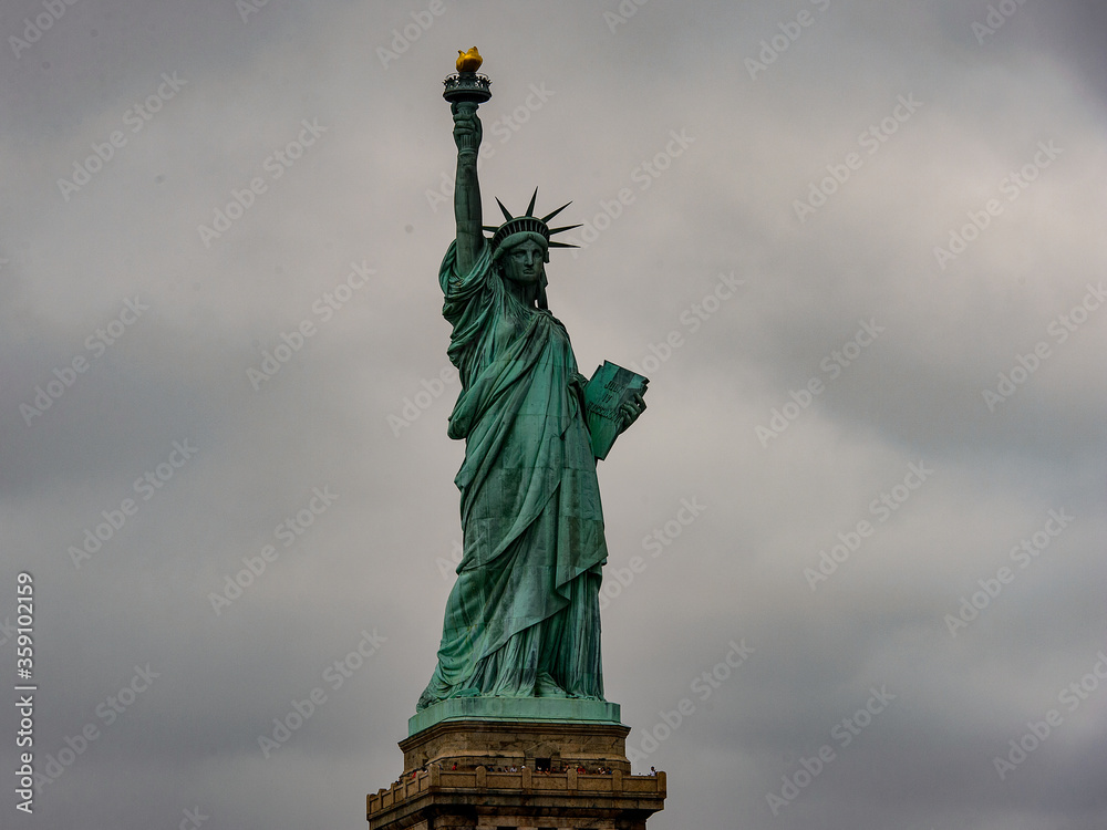 Obraz premium Statue of Liberty of New York on a cloudy day, NY, United Sates of America