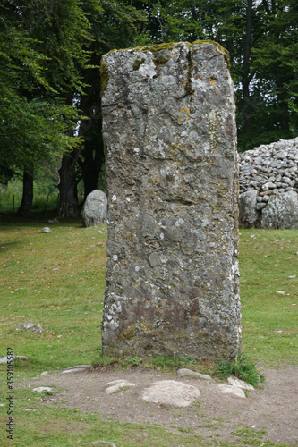 A standing stone at Balnuaran of Clava, east of Inverness, in the Highlands of Scotland. The site includes three circular Bronze-Age burial chambers. photo