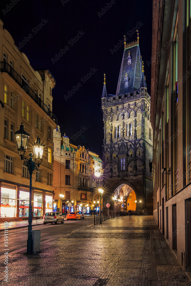 Powder Tower at night, built in 1475, a high Gothic tower in Prague, Czech Republic