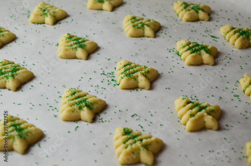 close up of spritz cookies on parchment paper