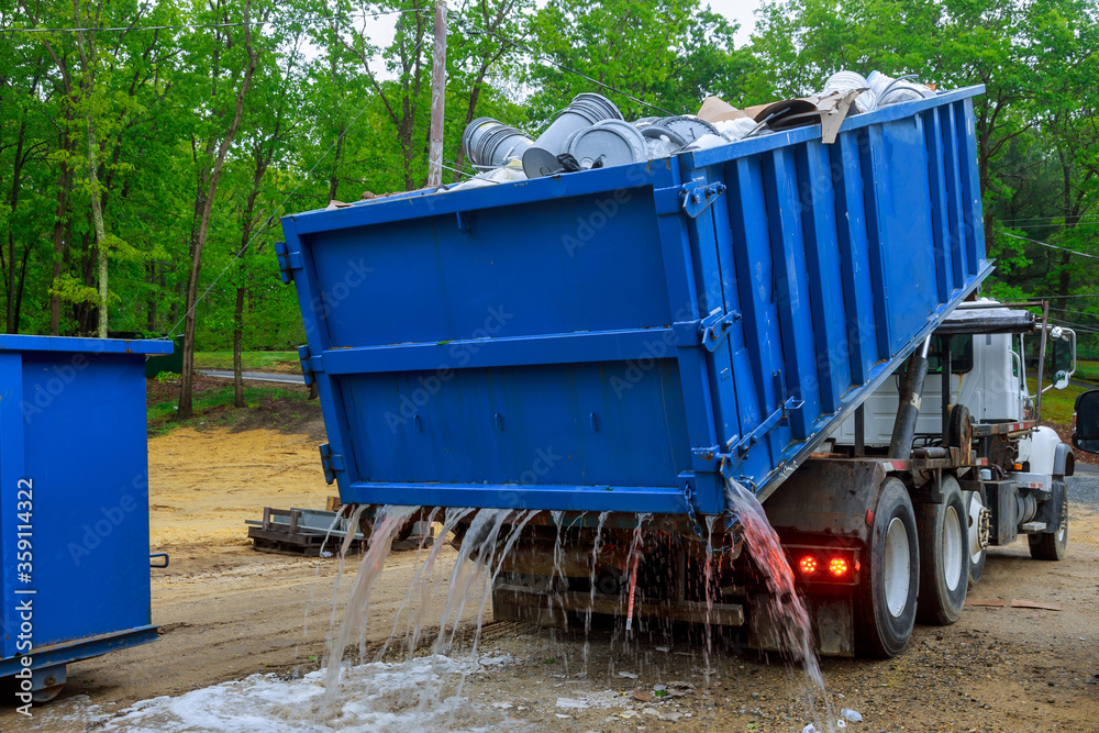 Truck loading a full recycling used construction material in the new building work site. Truck loading a full recycling used construction material in the new building work site.