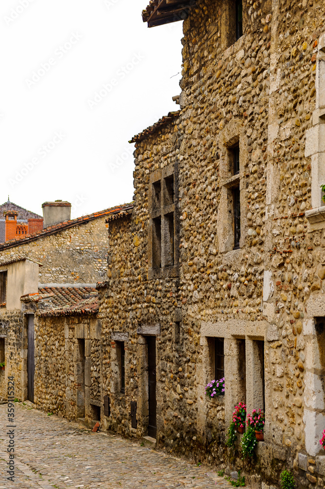 Old stone house in  Perouges, France, a medieval walled town, a popular touristic attraction.