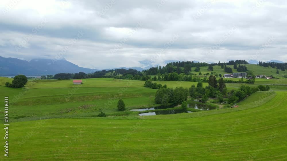 Typical landscape in Bavaria in the Allgau district of the German Alps - aerial view Typical landscape in Bavaria in the Allgau district of the German Alps - aerial view