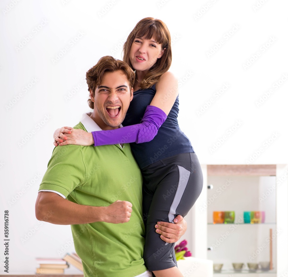 Fototapeta premium Man and woman discussing sports injury