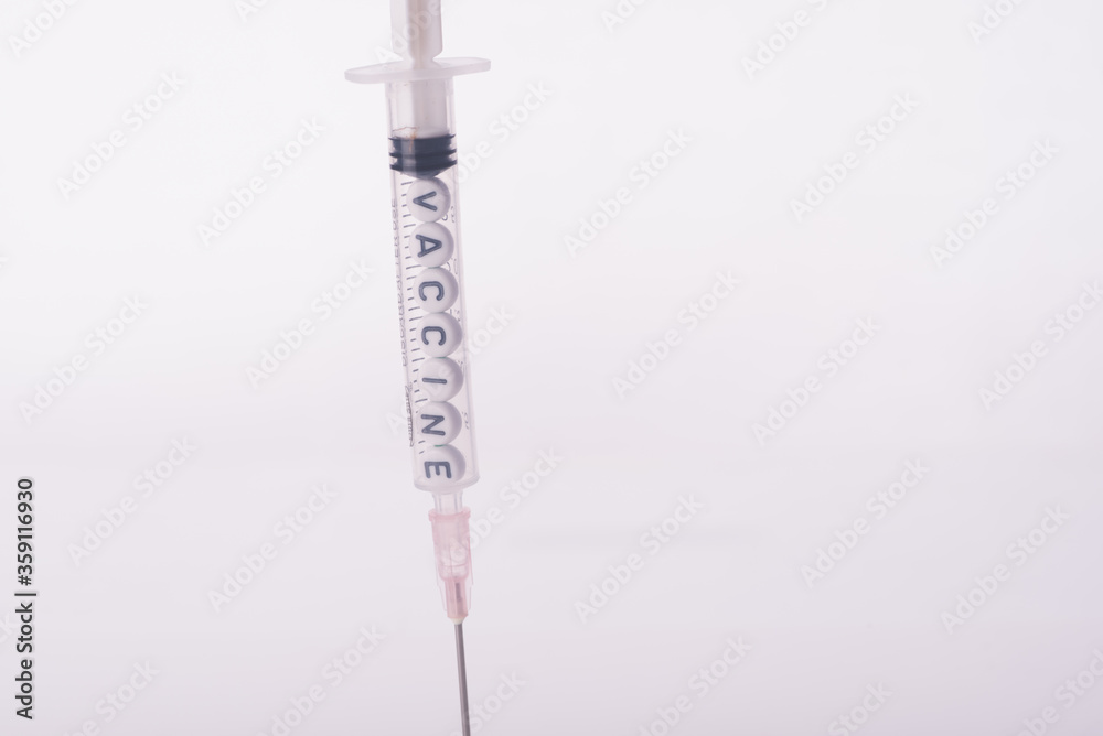 medical syringes,filled with the word vaccine,isolated over white,vaccination concept medical syringes,filled with the word vaccine,isolated over white,vaccination concept