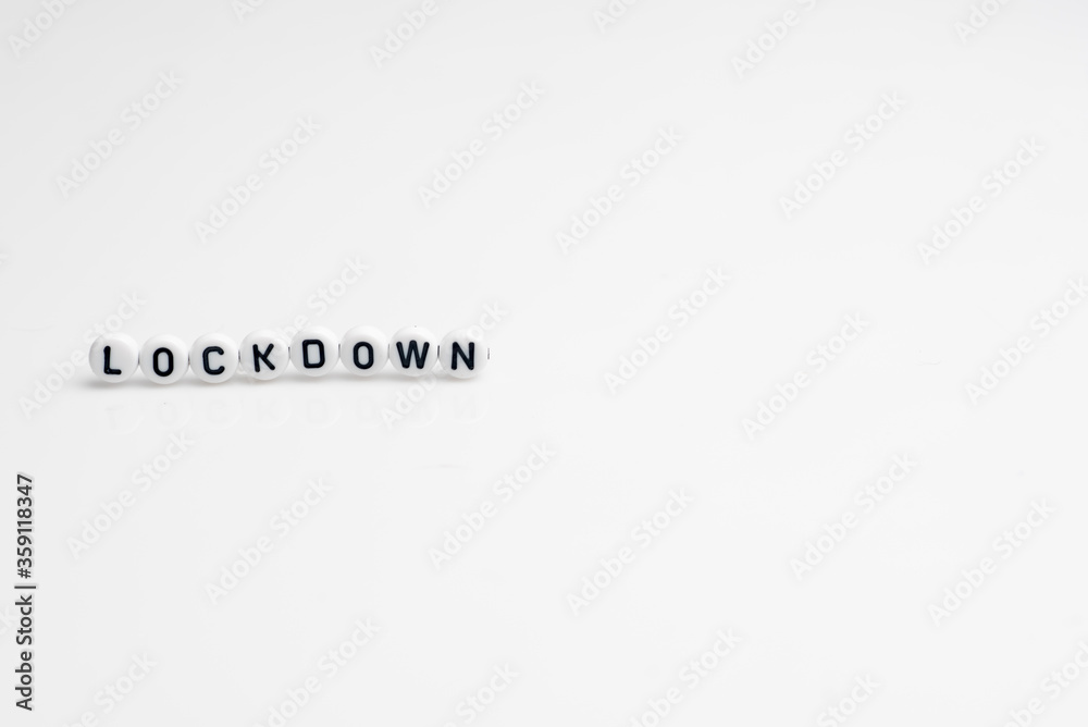Fototapeta premium The word lock down isolated over white background