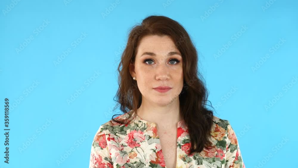 Young beautiful european woman says Yes.By shaking her head Young beautiful european woman says Yes.By shaking her head