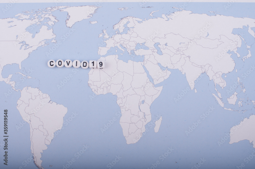 The word covid 19 over world map,high angle shot The word covid 19 over world map,high angle shot