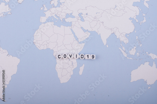 The word covid 19 over world map high angle shot