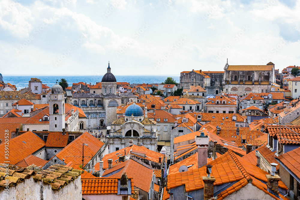 It's View from the wall on the roof tops of the Old Town of Dubrovnik on a cloudy day, Croatia