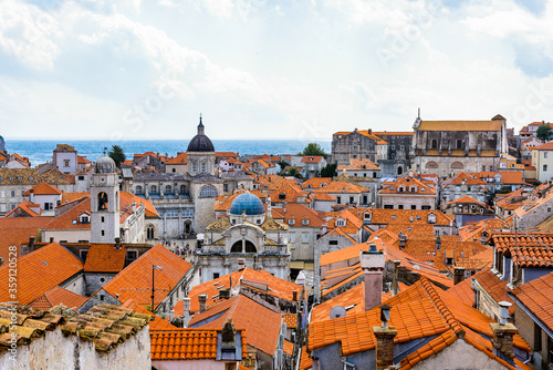 It's View from the wall on the roof tops of the Old Town of Dubrovnik on a cloudy day, Croatia