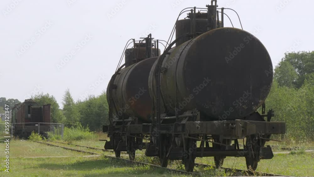 Black old train wagon on the tracks in Haapsalu Estonia Black old train wagon on the tracks in Haapsalu Estonia