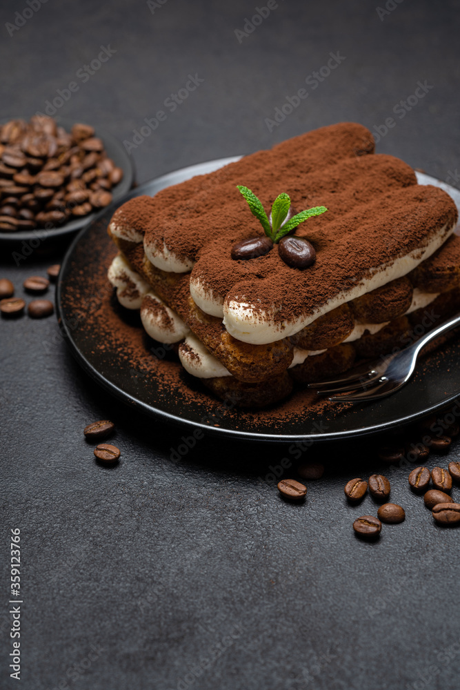 Classic tiramisu dessert on ceramic plate on concrete background Classic tiramisu dessert on ceramic plate on concrete background
