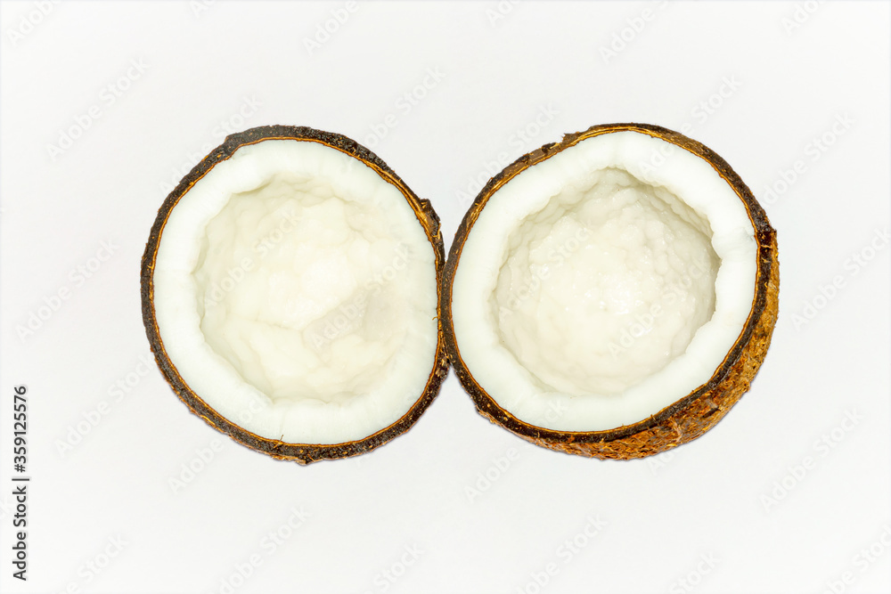 Fresh and organic half coconut on white background. Fresh and organic half coconut on white background.