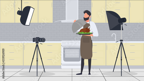 A male cook in the kitchen has a culinary blog. The guy in the kitchen apron is holding fried chicken. Vector.
