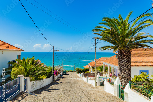 Picturesque streets and view over the ocean in the tiny Portuguese ocean village Ericeira, Portugal. Travel to the sea.